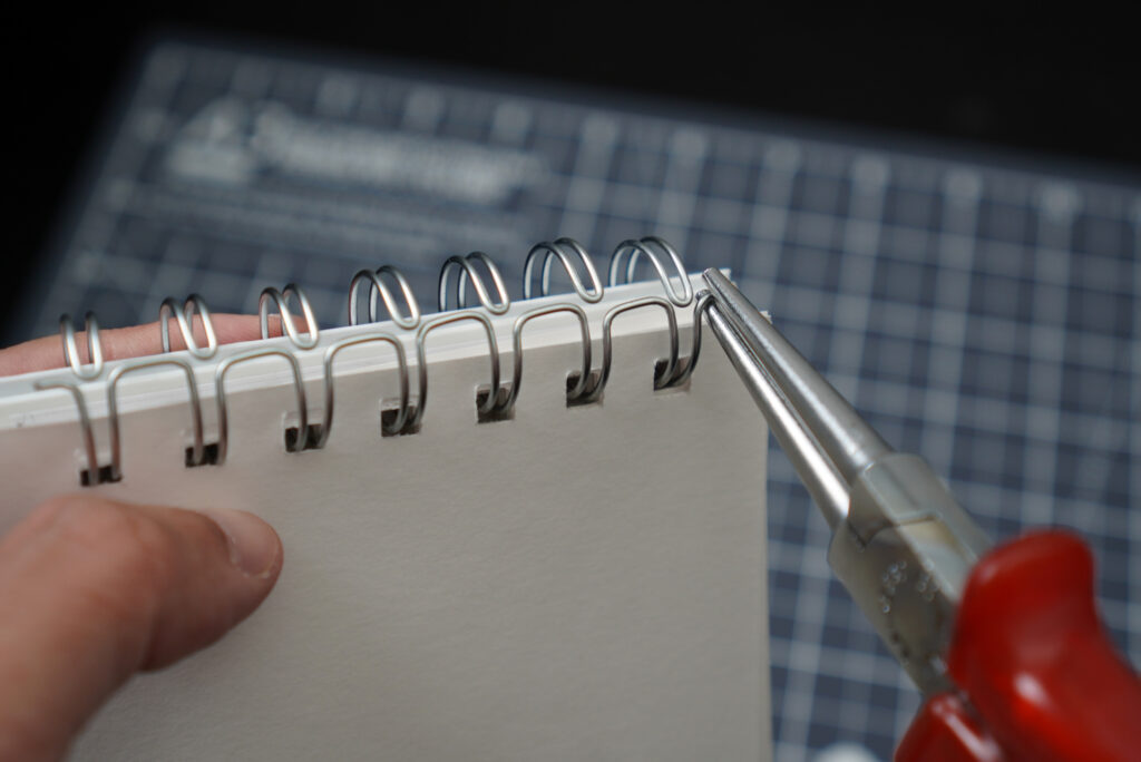 rounding the edges of the wire using round-nose plier